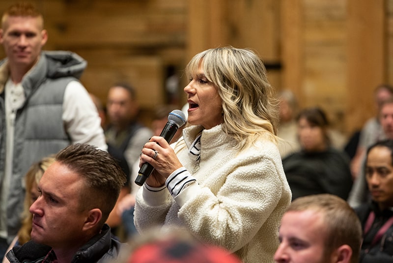 A Coach in the audience speaking on microphone.